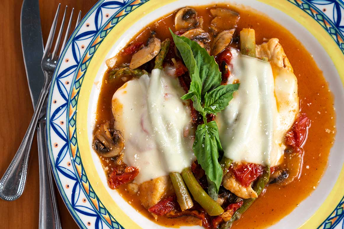 Chicken special with mushrooms, asparagus, sun-dried tomatoes and melted mozzarella
